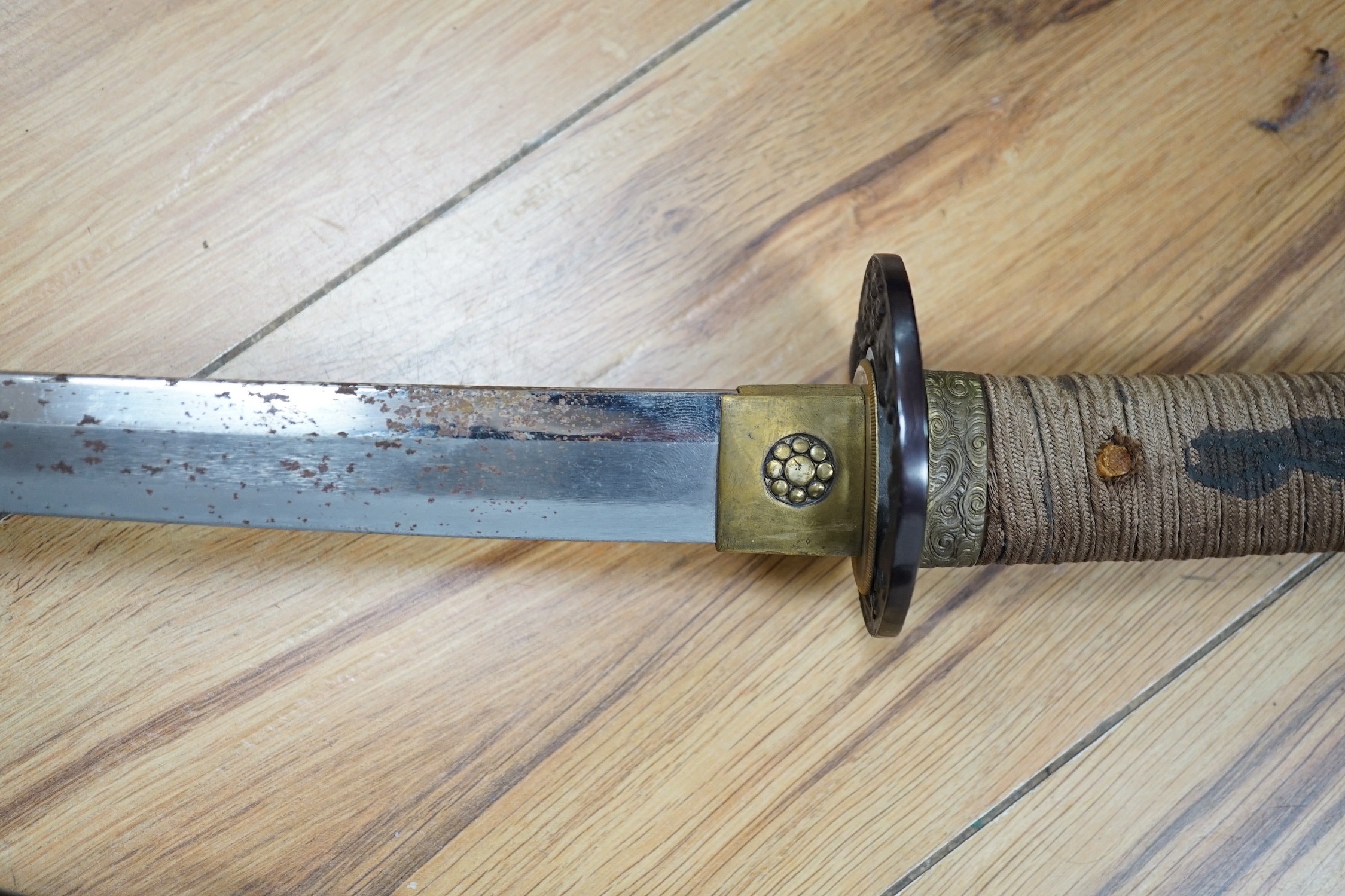 A 20th century Japanese wakizashi with cast iron ‘tiger’ tsuba, total length 73cm including scabbard